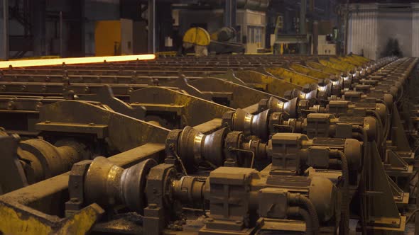 Steel Mill, Steel Pipes Production, Red-hot Pipe Transported on Production Line, Heavy Industry