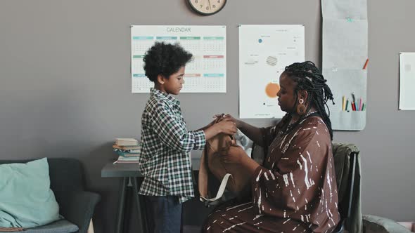 Mom Helping Son Get Ready for School