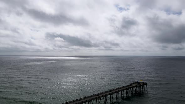 Relaxing Scene - Ocean Pier with Beautiful Clouds over Horizon, Aerial Drone Seascape