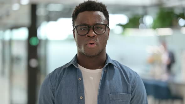 Portrait of Young African Man Showing No Sign By Shaking Head