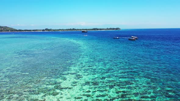 Bermuda islands, boats near the coast of the tropical island, coral reef in the crystal clear turquo