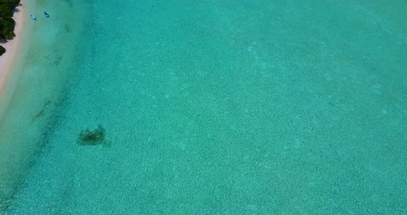 Natural overhead travel shot of a summer white paradise sand beach and turquoise sea background in v