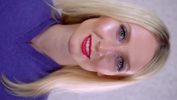 Portrait of a Woman Looking at the Camera and Smiling Evening Makeup