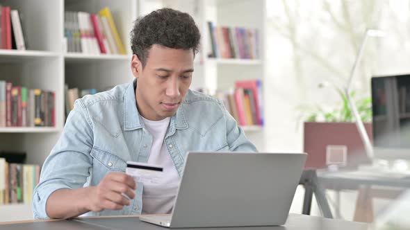 Online Shopping By Young African American Man, Using Credit Card for Payment