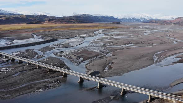 Drone Pulling Back From Bridge Over Hvannagil Estuary