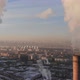 Aerial view of smoke rising from the chimney of a coal boiler. Dolly zoom effect. - VideoHive Item for Sale