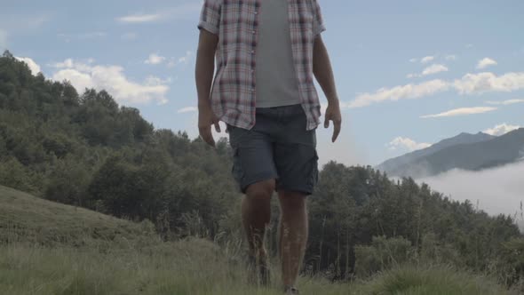 Young Man in Summer Day is Trekking Outdoor on Mountain Path Slow Motion