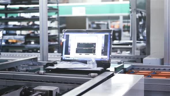 Laptop Computer on the Conveyor Belt of a Factory.