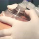 Doctor's hands are holding anesthesia mask on the patient's face - VideoHive Item for Sale