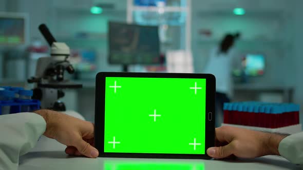 Pov Shot of Microbiologist Holding Tablet with Green Chroma Key alt