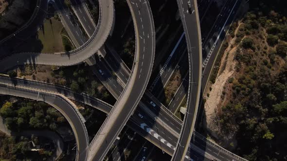 View from the drone down on a tangled and intersecting road with traffic, Haifa, Israel