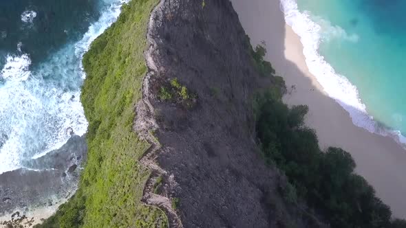 Wonderful aerial view flight bird's eye view drone shot to the path on the edge high in the sky atK