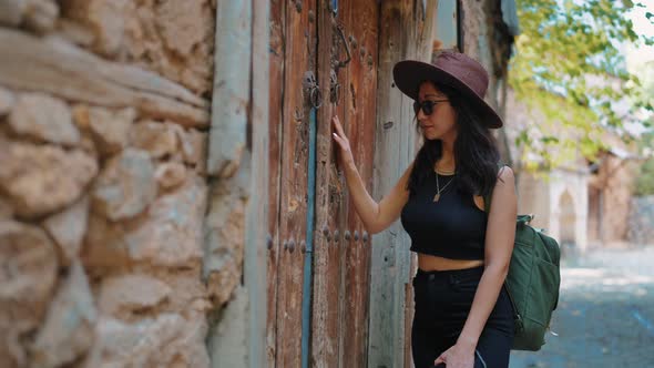 Tourist Woman in Front of Historical Door