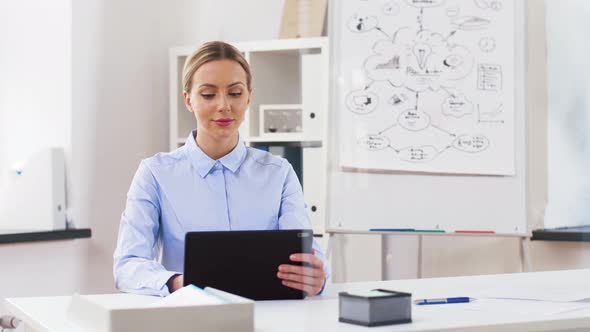 Businesswoman with Tablet Computer Works at Office 42