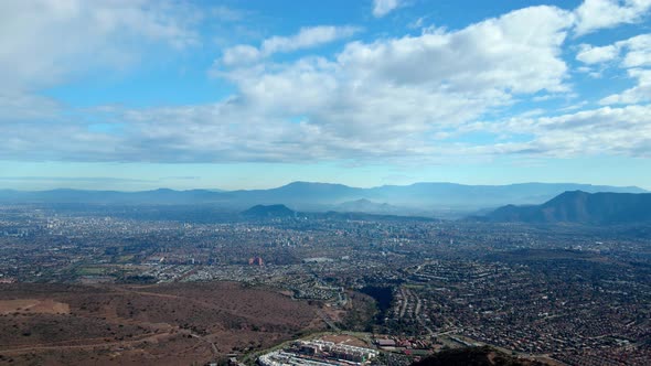 Aerial view dolly in of the Commune of Las Condes, Santiago, Chile on a clear day after the rain.