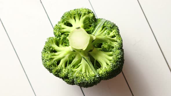 Top View of Green, Fresh, Raw Broccoli Placed on White Wooden Table