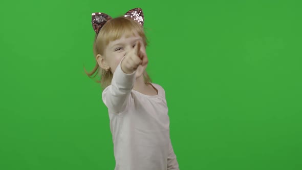 Girl in Headband with a Cat Ears Emotionally Points at Something with Her Hands