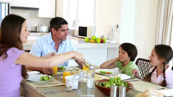 Happy Family Having Dinner Together