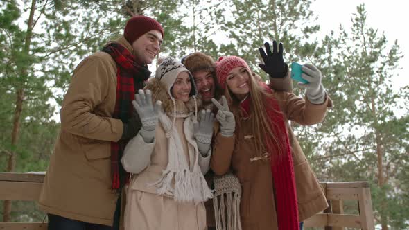 Young People Taking Selfie on Nature at Winter