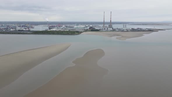 Scenic View Of Sandymount Strand Beach And Poolbeg Chimneys In Dublin, Ireland. aerial drone