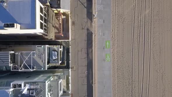 COVID-19 Lockdown empty beach footprints traces in sand.Beautiful aerial view flight Drone top-down