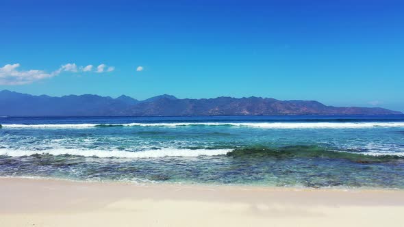 Luxury flying island view of a white sand paradise beach and aqua blue ocean background in colorful 