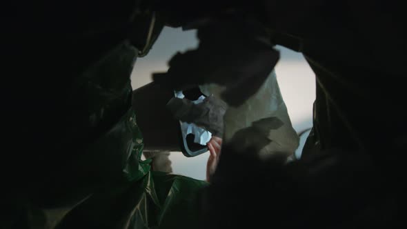 Woman Throws a Paper Waste in the Trash