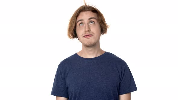 Portrait of Happy Hairy Man in Casual Tshirt Smiling with Perfect Teeth and Blowing Lock From