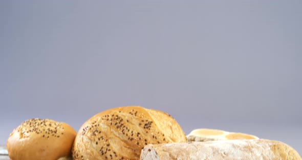 Various bread loaves with knife