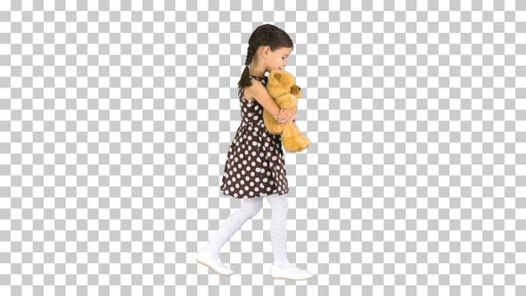 Little girl in polka dot dress hugging, Alpha Channel