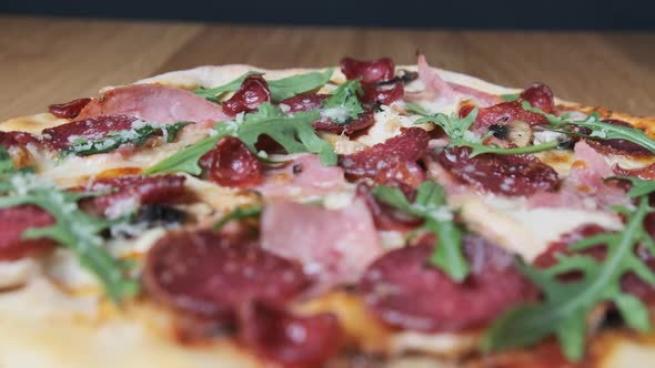 Appetizing Pizza on a Wooden Board in a Restaurant