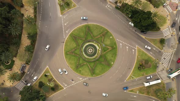 Aerial view of vehicles driving a roundabout in Toronto, Canada.