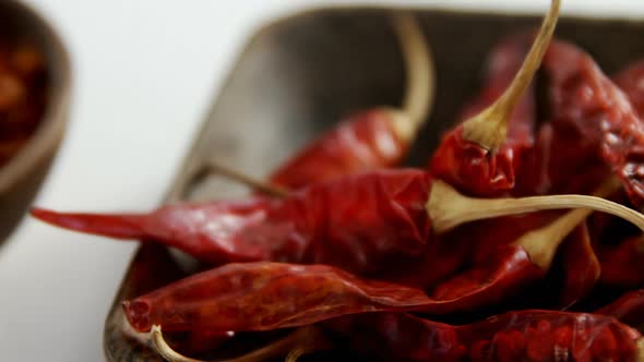 Dried red chili pepper and crushed red pepper in bowl 4k