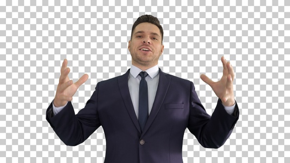 Man in formal clothes speaking to camera doing hand gestures