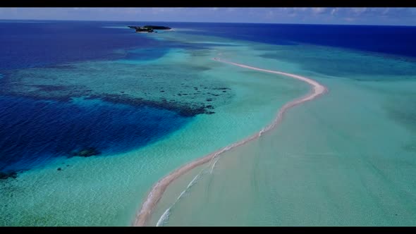 Aerial flying over landscape of beautiful coastline beach voyage by blue ocean with white sandy back