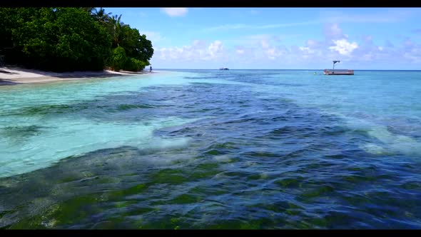 Aerial view texture of tranquil shore beach break by blue water and white sand background of a dayou