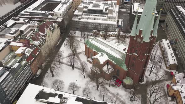 Cinematic wide angle revolving aerial shot of famous and historical St Clare church in central Stock