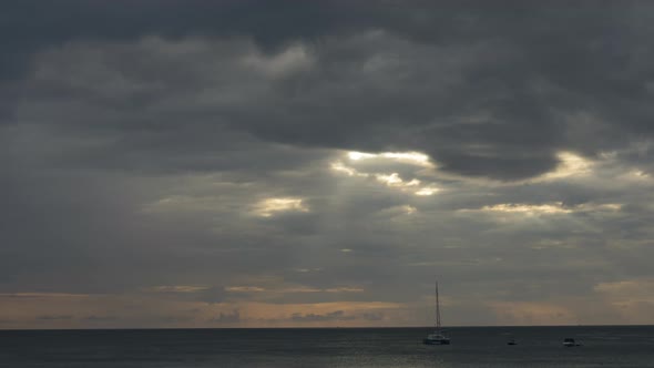 Yachts on the Background of Sunset and Dark Clouds