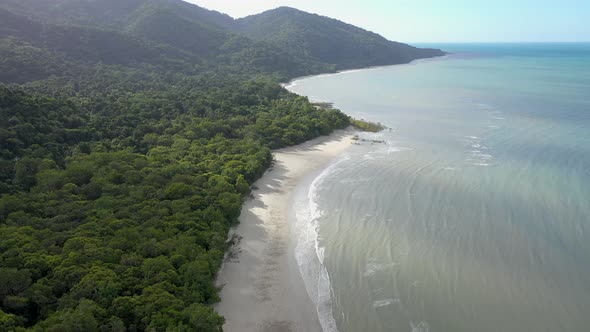 Cape Tribulation Beach aerial with ocean shadows, in Daintree Rainforest, Queensland, Australia