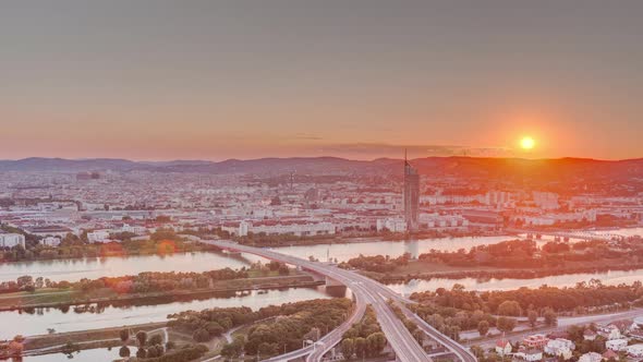Aerial Panoramic View of Sunset Over Vienna City with Skyscrapers Historic Buildings and a Riverside