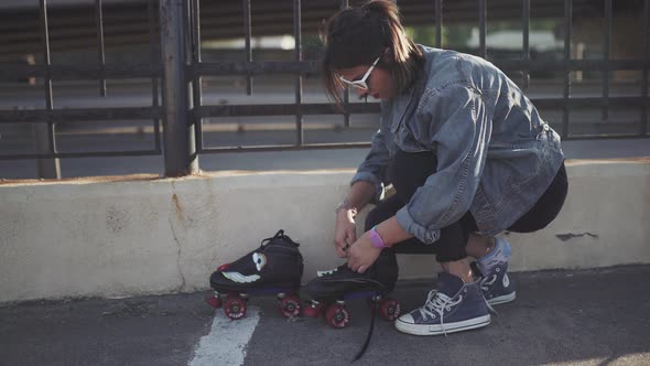 Attractive Young Woman with Roller Skating on the Street Having Fun Time at Sunset