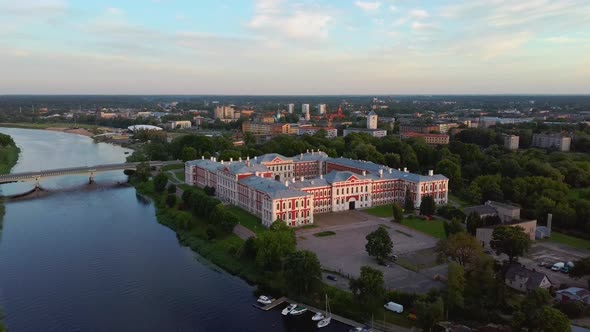 Aerial View of Jelgava City Panorama and Lielupe River in Latvia, Zemgale at Sunset 4K Dron Shot alt
