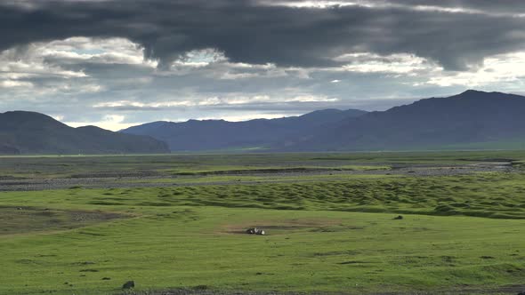 Asian Yurts in Green Plain Beside The Treeless Hill