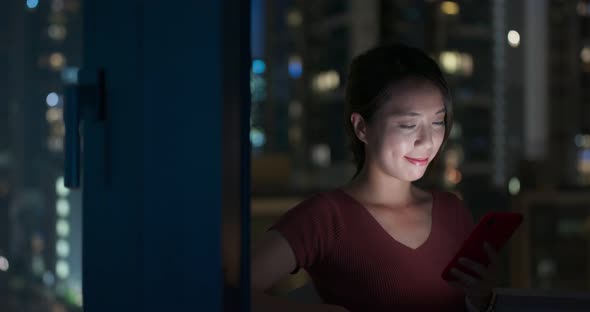 Woman use of mobile phone in the countryside