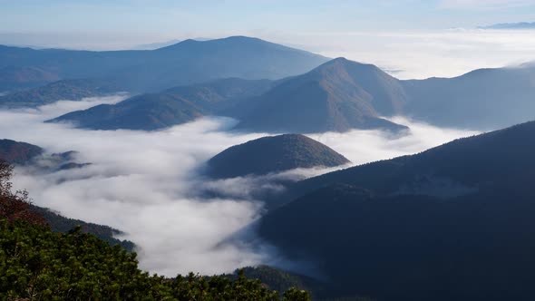 Clouds between the mountains, inversion, Magic of the mountains, high altitude,