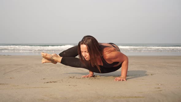 Woman Practices Yoga Outdoors. The Girl Does Yoga Asana. A Young Woman Does Yoga in Nature