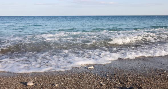 Waves and Sea Surf on Rocky Beach