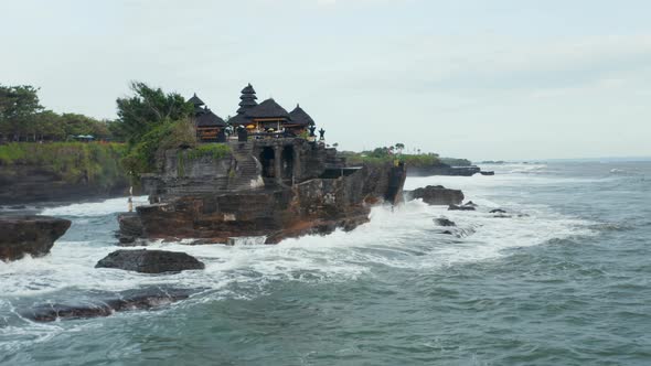 Closing in on Empty Tanah Lot Temple on Dark Dangerous Cliffs in Bali Indonesia