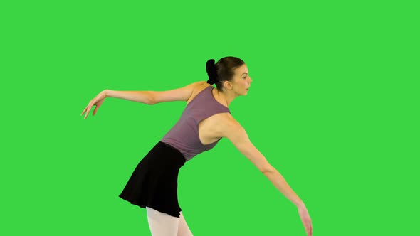 Young Ballerina Walks Demipointe Waving Arms on a Green Screen Chroma Key