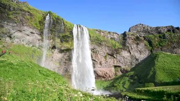 Seljalandsfoss Waterfalls and Mountains in Summer Season Iceland Slow Motion